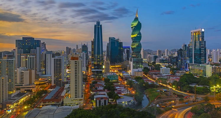 The colorful panoramic skyline of Panama City at sunset with high rise skyscrapers