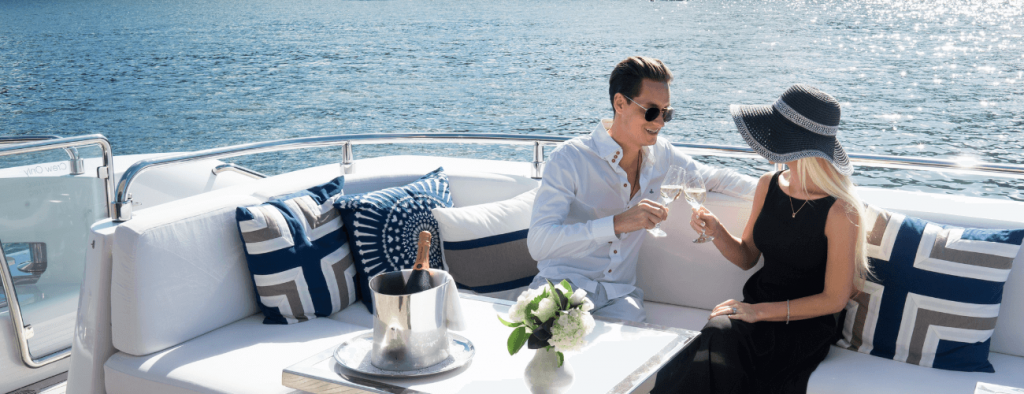 couple enjoying glass of champagne on deck